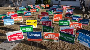 picture showing dozens of yard signs and lawn signs 