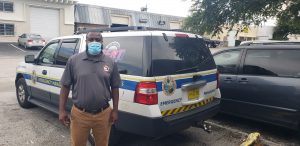 Picture of an Emergency Team Member working non-stop, Printing Testing Flyers