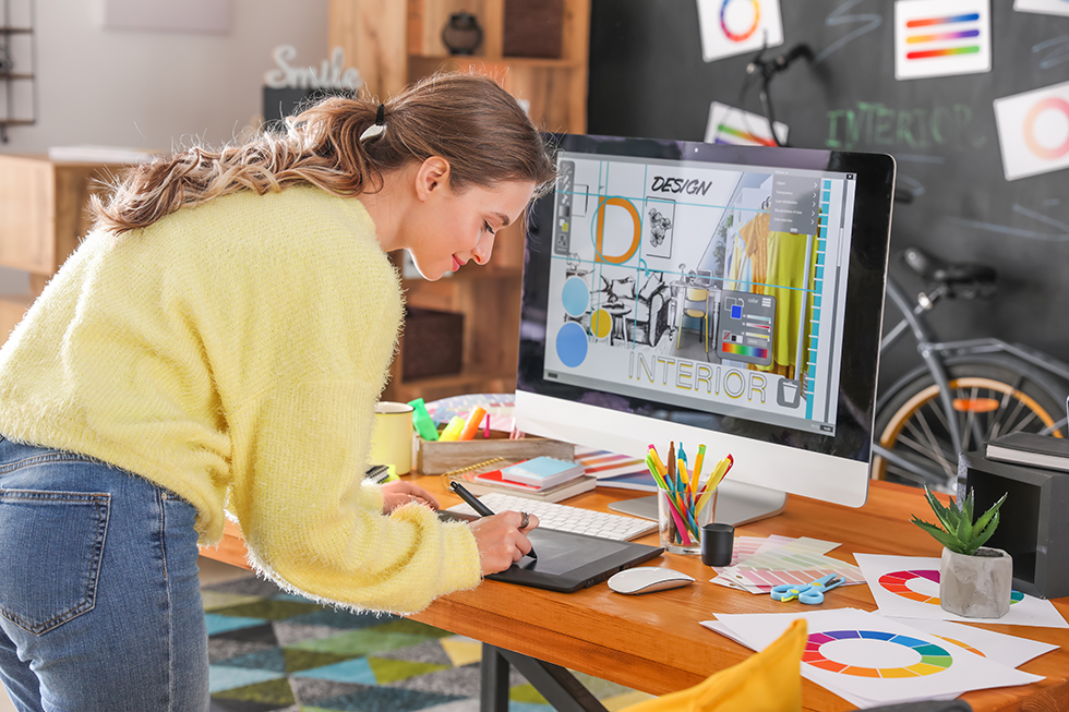 Woman-Designing-A-Flyer-On-Her-Computer