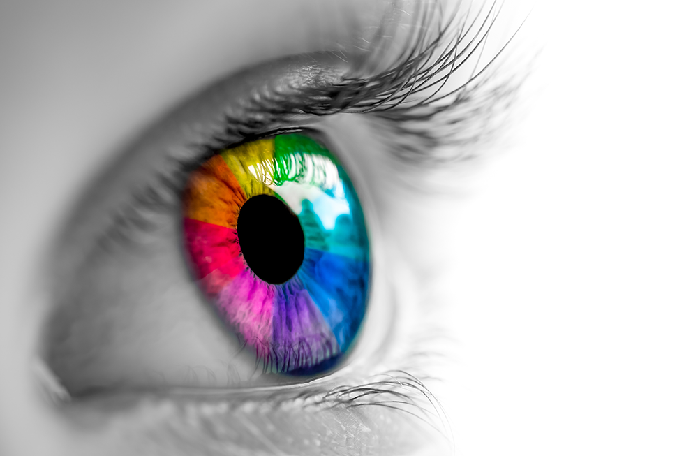Black and white image of an eye with rainbow colors around the iris
